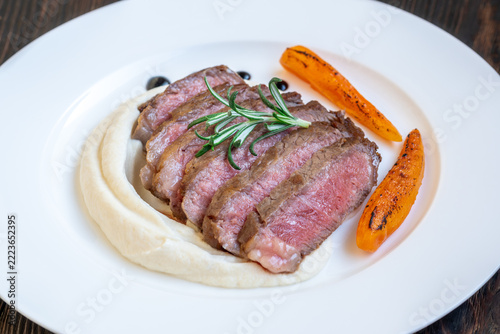 Restaurant style Wagyu steak with celery root puree carrots rosemary and balsamic glaze