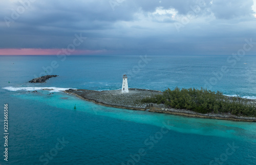 Exposure done at sunset of the Nassau Harbour Lighthouse near Colonial Beach, built in 1847, with the awesome turquoise blue waters surrounding the beautiful island of the Bahamas