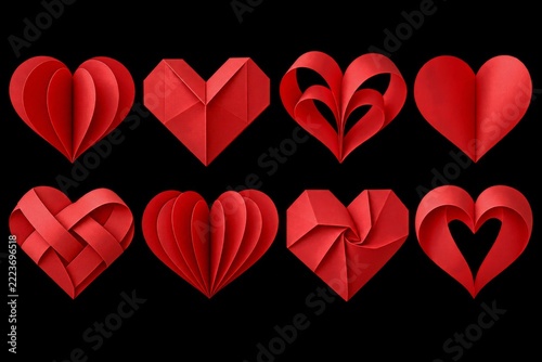 Collection of folded red paper hearts isolated on a transparent background