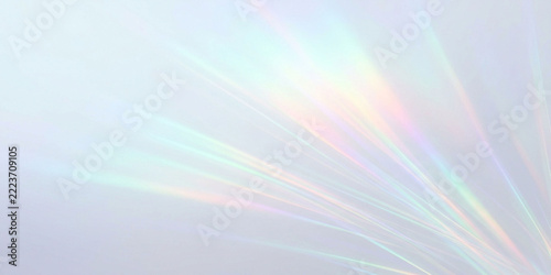 Prismatic light dispersion forming subtle rainbow glow on neutral backdrop with spectrum abstract background gradient colorful transparent diffusion luminance