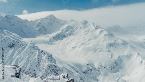 Fotografie Snow-covered Caucasus mountain peaks and glacial valley with observation platfor