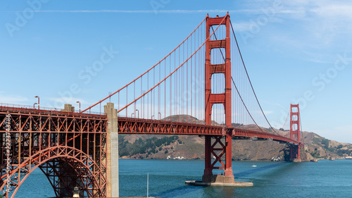 Golden Gate Bridge in San Francisco, California, USA, seen from the south end, with its red steel arch over Fort Point and the south tower above the bay