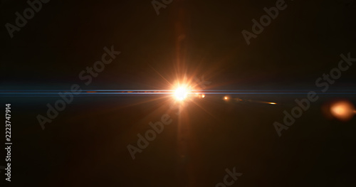 A lens flare overlay with a warm golden light source, a blue horizontal streak, realistic optical reflections, and a subtle glow on a black background. A premium visual effects asset.