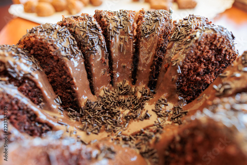 Close up of ring cake with glossy icing and sprinkles