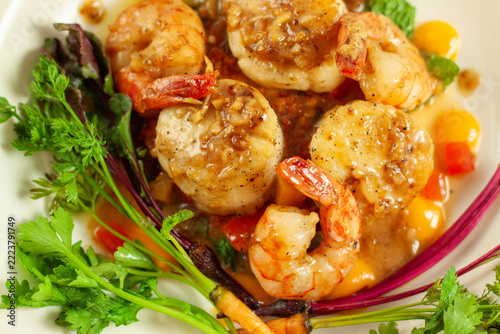 Plated Pan Seared Sea Scallops and Garlic Shrimp with Roasted Root Vegetables
