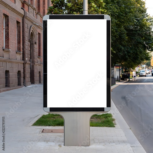 Modern Digital Advertising Display On Urban Street Sidewalk Near Building