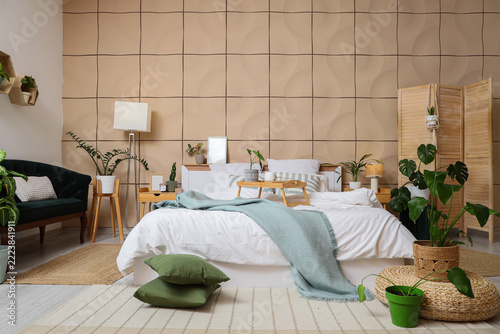 Home wellness and interior design, cozy bedroom with house plants and comfort...