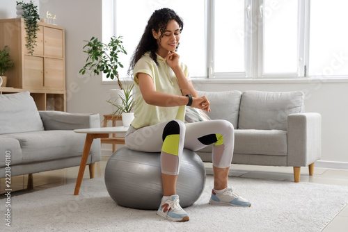 Fitness tracking and healthy lifestyle, woman checking progress on smartwatch...