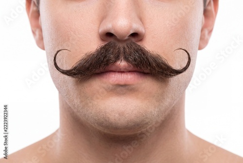 Man with Groomed Handlebar Mustache and Curled Tips on White Background