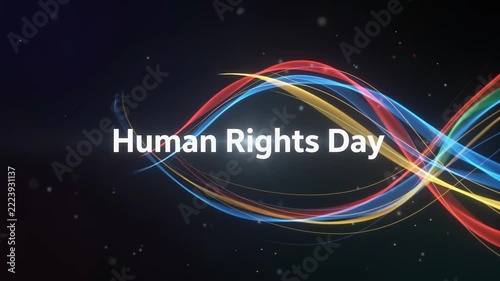 A vibrant graphic celebrating Human Rights Day with white text and colorful flowing light trails on a dark, starry background, symbolizing global unity and justice.