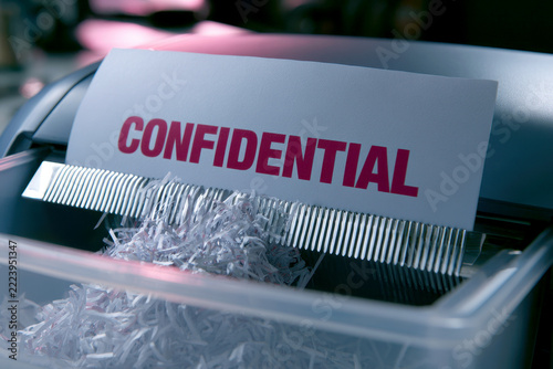 Paper Shredder Machine Destroying Confidential Document File.