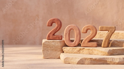 Number 2027 year concept photo. Terracotta clay numbers placed on beige stone pedestals. Minimalist warm earth tone product display background for future planning and calendar design