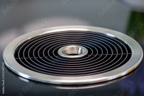 Downdraft extractor ventilation system built into modern induction cooktop