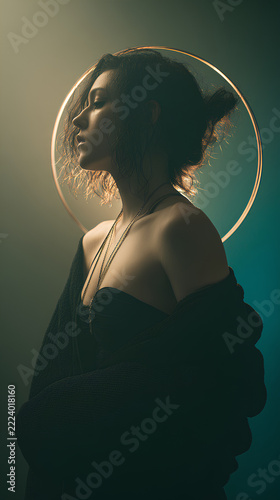 Moody backlit silhouette with ring light on one side and vertical LED panel behind. Abstract pastel glow in background