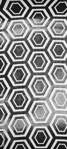 A bold geometric pattern of repeating hexagons with layered outlines, creating a modern and visually striking design. Ideal for backgrounds, graphic design, and abstract commercial themes.
