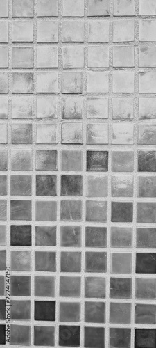A close-up of glossy square tiles arranged in a precise grid, showcasing modern design, symmetry, and material quality. Suitable for architecture, interiors, and decorative backgrounds.

