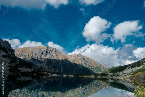 A mountain pond reflecting the peaks. Czarny Staw pod Rysami. High Tatras.
