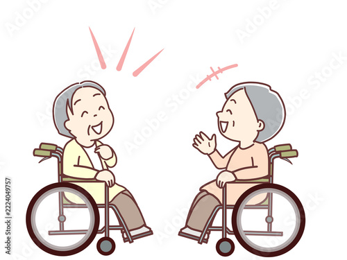 介護、楽しい会話をする車いすの高齢者