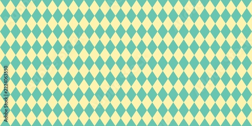 Seamless argyle pattern with turquoise and yellow diamond shapes. Geometric background for fabric, wallpaper, and wrapping paper.