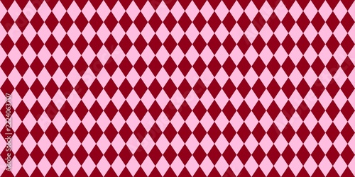 Seamless argyle pattern with red and pink diamond shapes. Geometric background for fabric, wallpaper, and wrapping paper.
