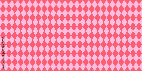 Seamless argyle pattern with coral red and light pink diamond shapes. Geometric background for fabric, wallpaper, and wrapping paper.