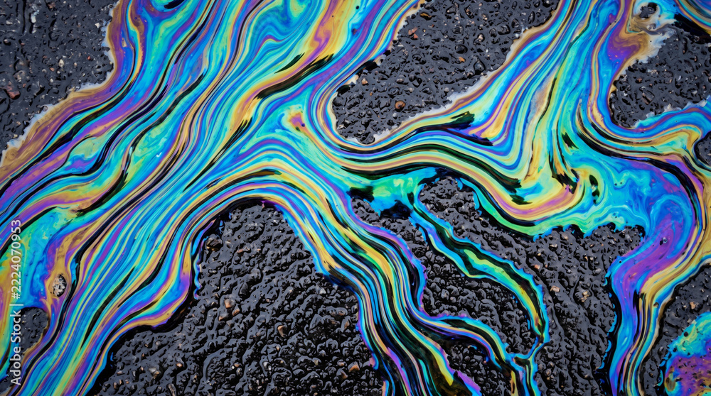 Fototapeta premium Crisis texture environment background with vivid oil film flow forming abstract colorful pattern and dramatic. Global climate change drought disaster earth nature ecology abstract ground surface