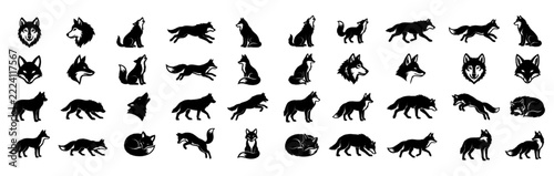 Group of canine silhouettes depicting wolves and dogs in varied positions