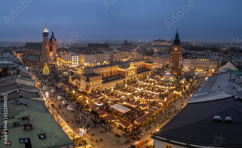 Krakow, oland, evening aerial view of illuminated Main Square with Christmas Fairs crowded with people