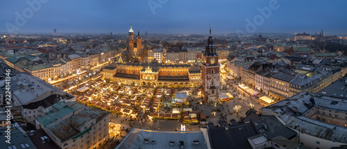 Krakow, oland, evening aerial view of illuminated Main Square with Christmas Fairs crowded with people