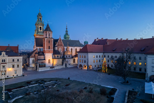 Wawel cathedral and castle with colorful illuminated Christmas tree, blue hour, Krakow, Poland