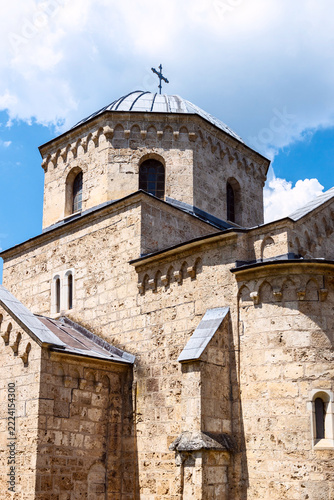 Close view of the stone dome and arched windows of Gradac Monastery, Serbia
