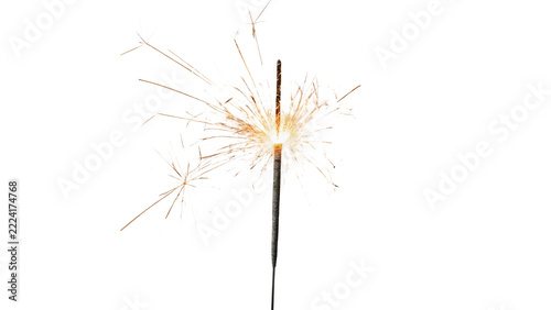 Single lit glowing sparkling festive Christmas celebration sparkler stick isolated on transparent background