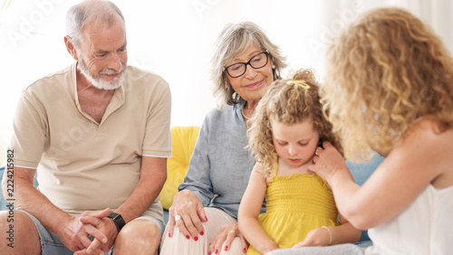 Fotografie Multi generational family bonding, grandparents and daughter enjoying time with