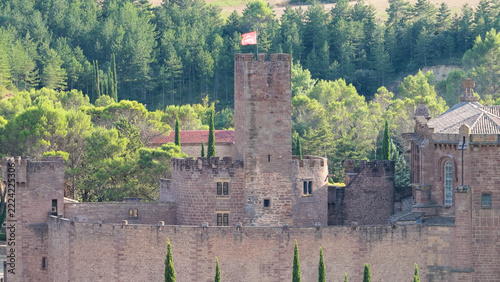 Javier Castle showing its medieval architecture and stone walls surrounded by dense green forest in the Navarre region