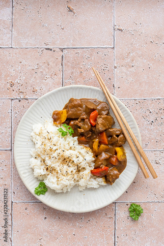 Japanese Chicken Katsu Curry Served With Rice on a Plate With Chopsticks