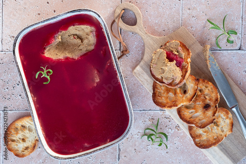 Delicious Spread of Liver Pate Served With Toasted Bread and Jelly on a Wooden Board
