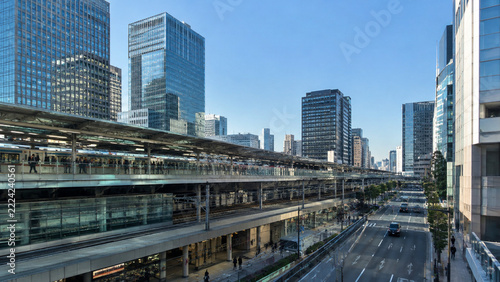 Modern Japanese Cityscape with Railway Station, Skyscrapers, and Urban Traffic