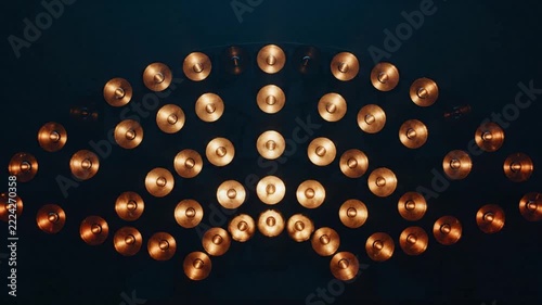 Vintage typewriter keys arranged in geometric symmetry pattern against dark textured background