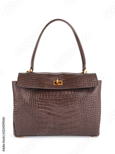 Women's brown faux leather handbag with crocodile embossed texture and gold hardware isolated on white background, front view