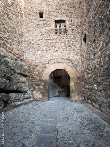 Albarracín medieval castle stone archway and cobbled street