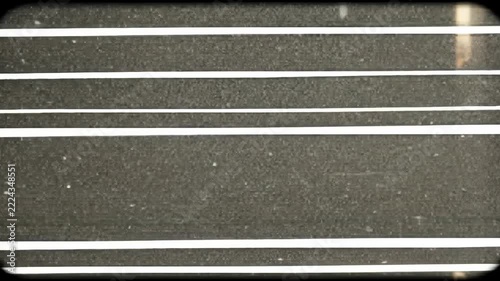 Abstract video of parallel lines and shapes with a dark background.