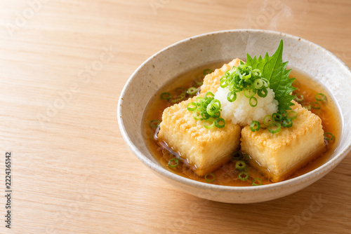 Japanese agedashi tofu with grated daikon in dashi broth