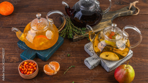 Spiced tea in glass teapots, a warming sea buckthorn drink, pear tea, thyme tea