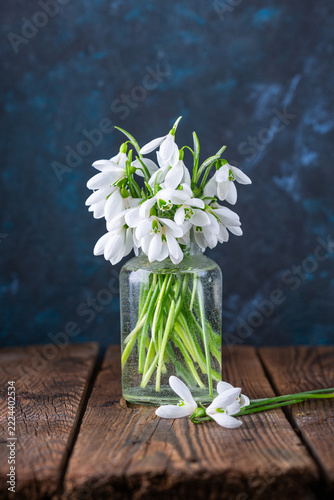 
a bouquet of snowdrops in a glass vase