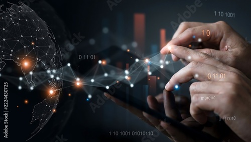 Hands touching tablet with global network data overlay during digital analytics for technology concept