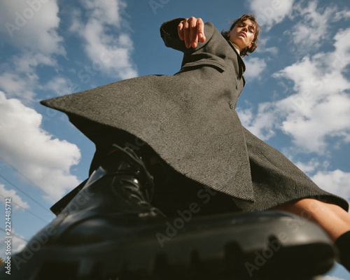 Experimental fashion photography featuring bold styling and dramatic perspectives captured with an ultra-wide-angle lens from extreme low and high camera angles.