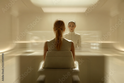 a woman looking at computer screen and a woman