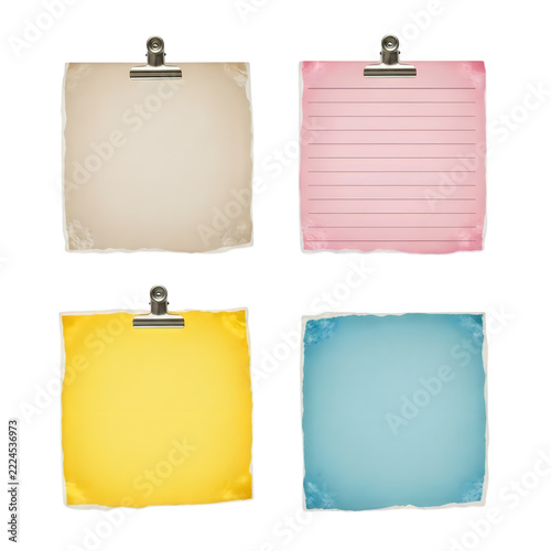 Set of colorful paper notes held with metal binder clips