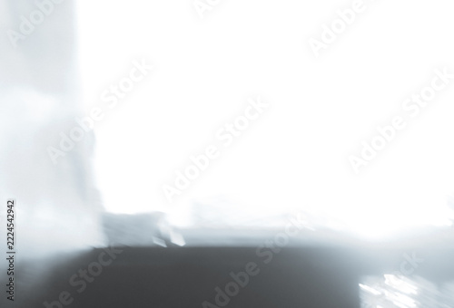 Minimalist Ethereal Background featuring Bright Overexposed White Light and Soft Blurry Shapes