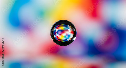 Water droplet with rainbow reflection